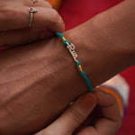 Run Silver Watch charm Rakhi - Quirksmith