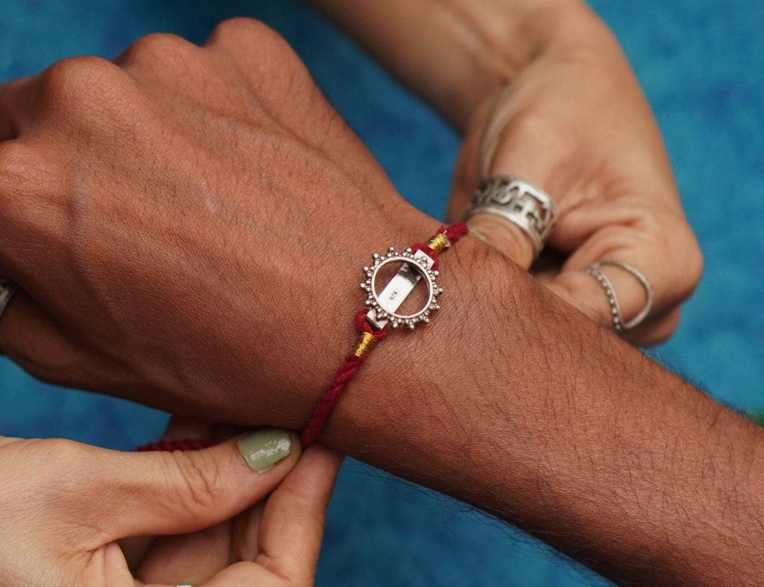 Quirksmith | Elegant Sun Watch Charm Rakhi in Sterling Silver – A Unique Rakhi for Your Brother