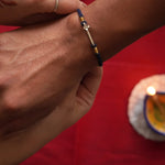 Tiny Flower Silver Watch Charm Rakhi - Quirksmith