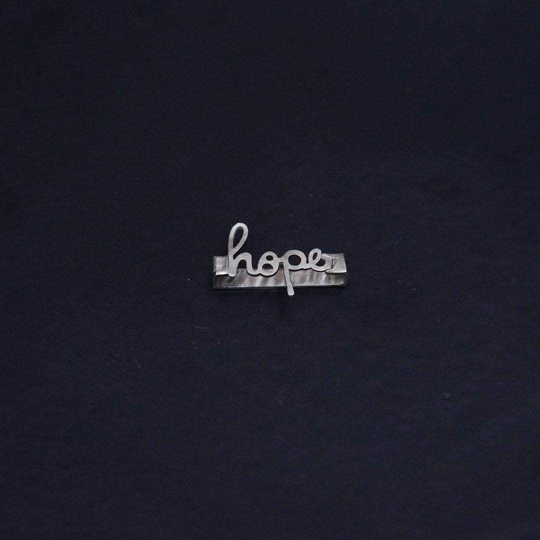 Quirksmith's Hope Watch Charm, a symbol of hope in 92.5 Silver. Perfect for couples interesting Valentine's Day gifts.
